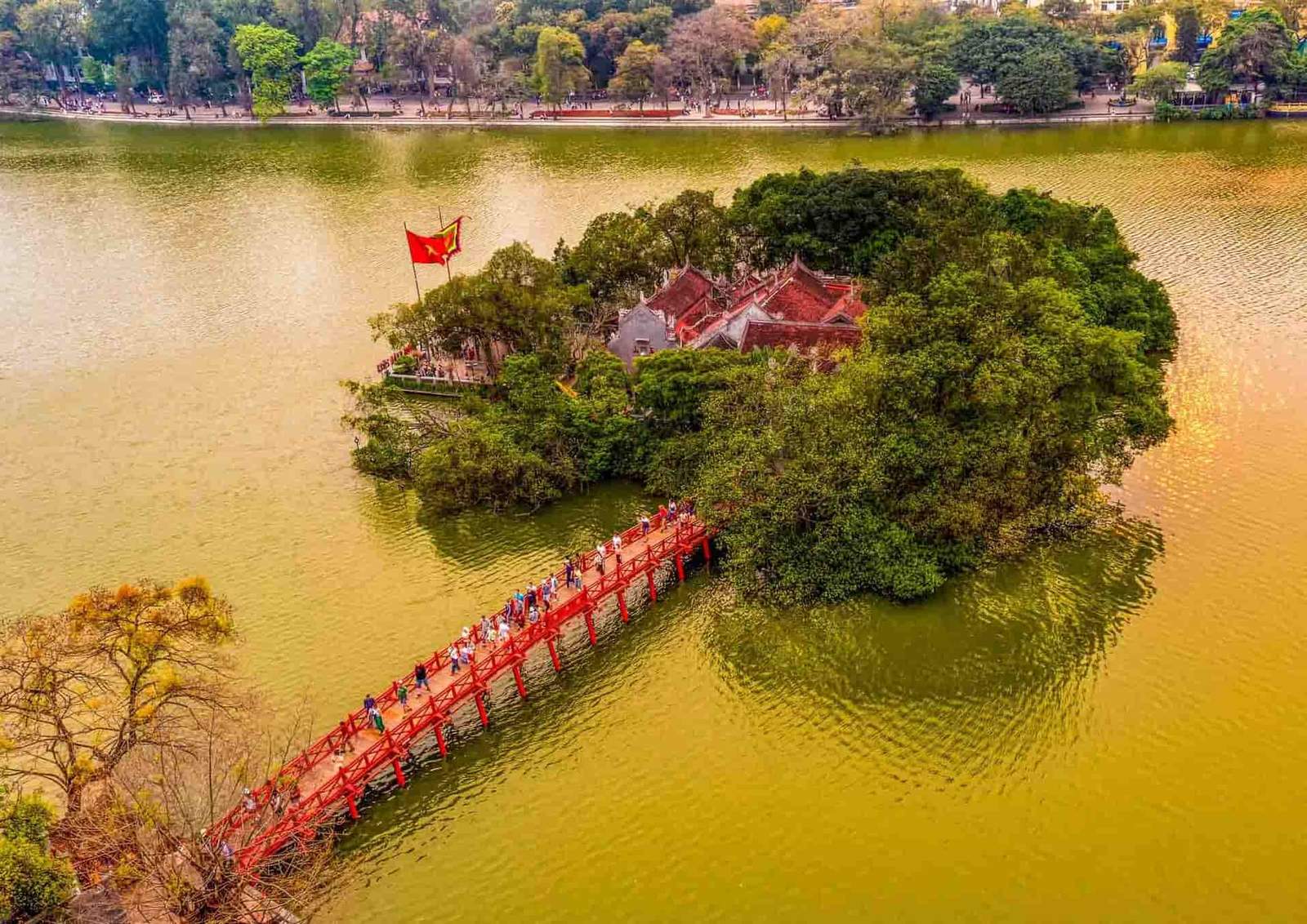 Ngoc Son Temple on Hoan Kiem Lake in Hanoi Vietnam with the iconic red The Huc Bridge