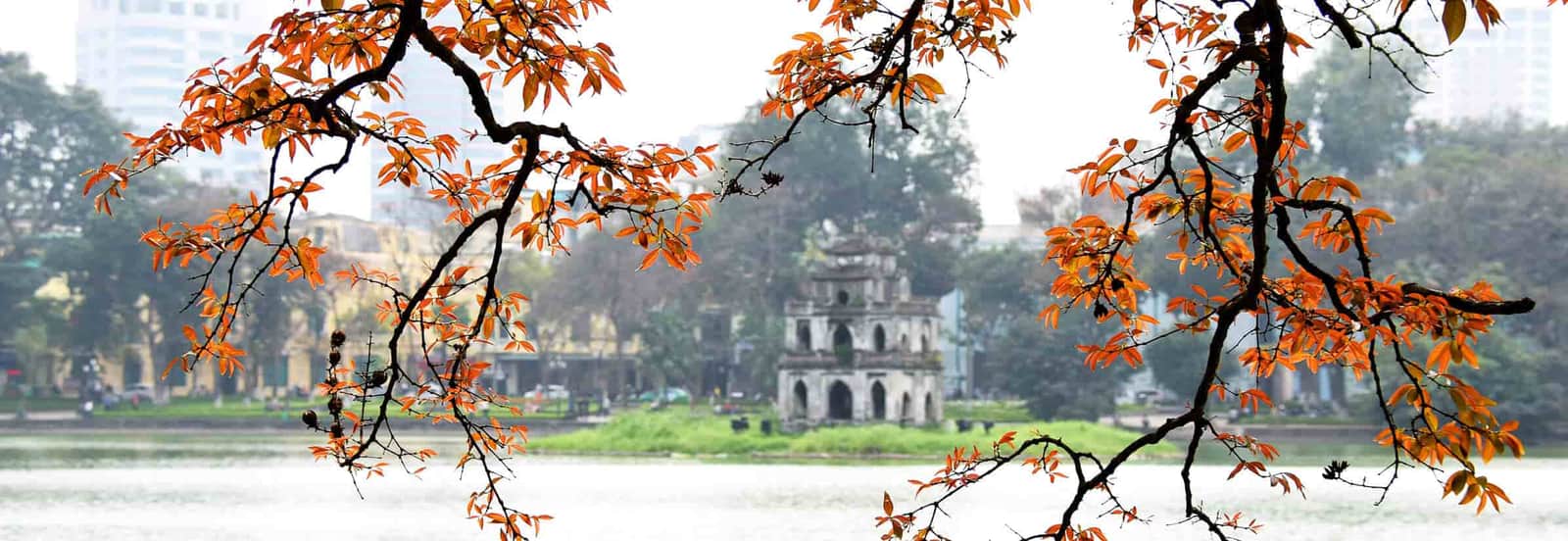 Turtle Tower at Hoan Kiem Lake in Hanoi Vietnam surrounded by peaceful greenery
