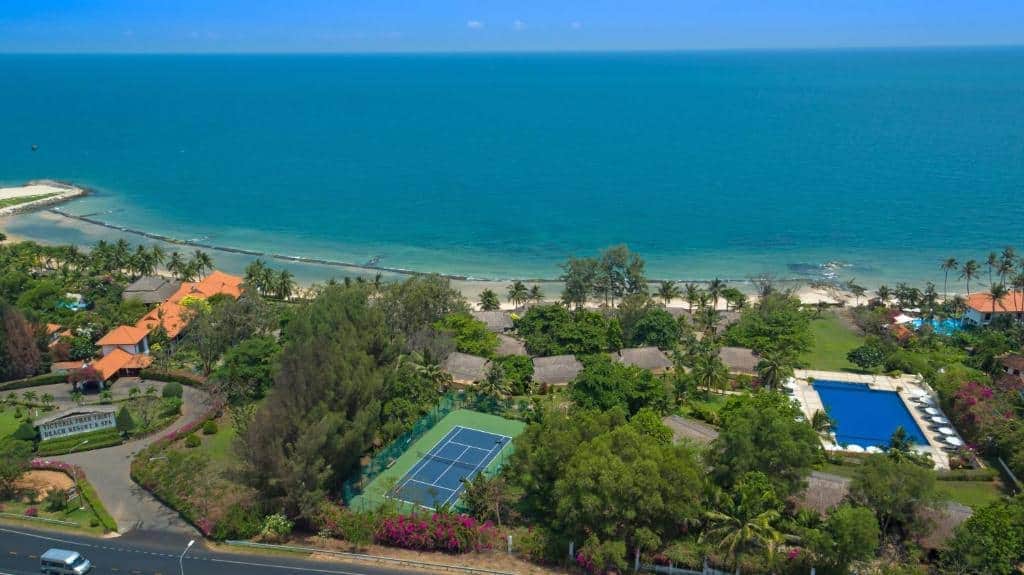 Enjoy a luxurious beachside resort featuring a swimming pool, tennis courts, lush gardens, and stunn.
