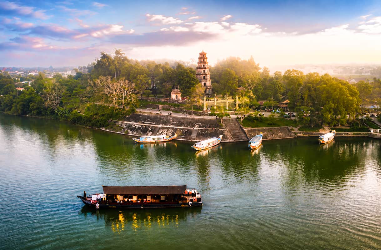 Hue Imperial Night with royal architecture and dragon boats on the Perfume River