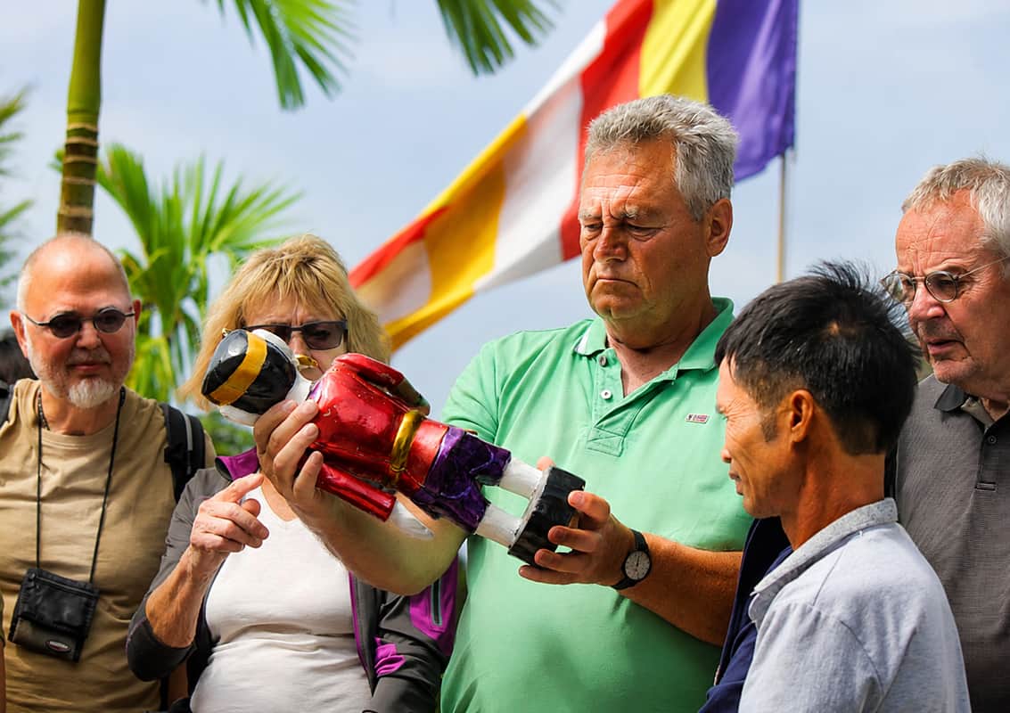 International travelers exploring a traditional Vietnamese cultural experience