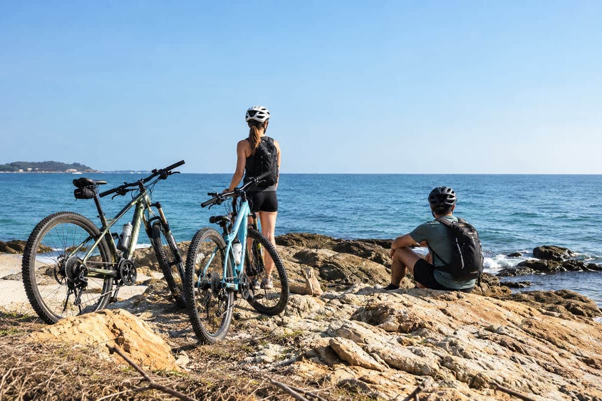 yclists with mountain bikes on the coast of Koh Samet, Rayong, Thailand